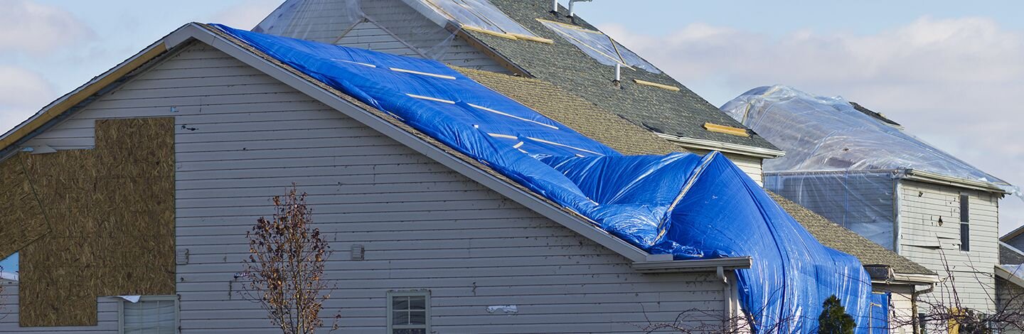 Minnesota neighborhood with storm damaged homes in need of repairs